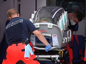 German army emergency personnel load into their ambulance the stretcher that was used to transport Russian opposition figure Alexei Navalny on August 22, 2020 at Berlin's Charite hospital.