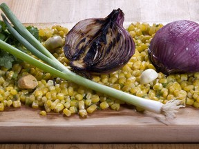 Cedar-grilled corn and red onion salsa is seen in this April 6, 2010 photo.