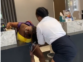 In a viral video, a woman and a staffer from the Embassy Suites by Hilton Atlanta Galleria brawl in the lobby Monday, Aug. 17, 2020.