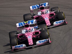 Racing Point's Canadian driver Lance Stroll (front) and teammate Sergio Perez drive at the Circuit de Catalunya in Montmelo near Barcelona on August 16, 2020, during the Spanish Grand Prix.
