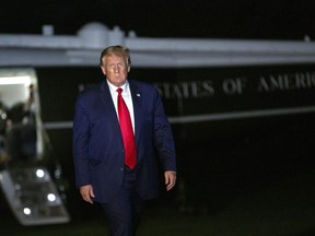 U.S. President Donald Trump walks on the South Lawn of the White House after arriving on Marine One in Washington, D.C., U.S., on Sunday, Aug. 9, 2020.