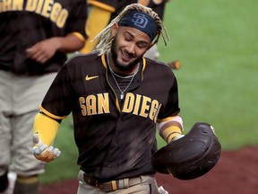 Fernando Tatis Jr. of the San Diego Padres celebrates after hitting a grand slam against the Texas Rangers at Globe Life Field on August 17, 2020 in Arlington.