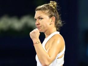 Romania's Simona Halep reacts during her semi final match against Jennifer Brady of the U.S.