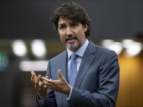 Prime Minister Justin Trudeau rises during a sitting of the Special Committee on the COVID-19 Pandemic in the House of Commons Wednesday July 22, 2020 in Ottawa.