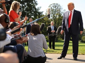President Donald Trump talks to reporters as he leaves the White House for a trip to Minnesota and Wisconsin August 17, 2020 in Washington.