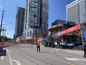 A construction crane collapsed into the intersection of Dundas St. E. and River St. Thursday morning.