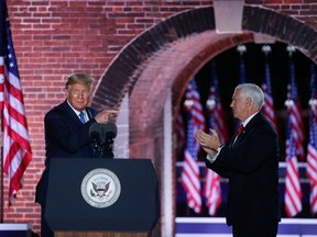 U.S. Vice President Mike Pence is joined onstage by U.S. President Donald Trump after delivering his acceptance speech as the 2020 Republican vice presidential nominee during an event of the 2020 Republican National Convention held at Fort McHenry in Baltimore, Maryland, U.S, August 26, 2020.