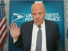 U.S. Postmaster General Louis DeJoy is sworn in to testify via video feed during a virtual hearing of the U.S. Senate Homeland Security and Governmental Affairs Committee entitled "Examining the Finances and Operations of the United States Postal Service During COVID-19 and Upcoming Elections" in Washington, U.S., August 21, 2020.