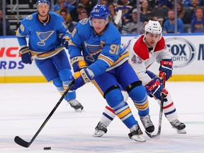 Vladimir Tarasenko of the St. Louis Blues moves the puck up ice against Jordan Weal of the Montreal Canadiens at Enterprise Center on Oct. 19, 2019 in St Louis.