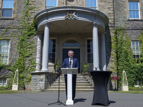 New Brunswick Premier Blaine Higgs talks with journalists after calling an election following a visit with Lt.-Gov Brenda Murphy at Government House in Fredericton on Monday, Aug. 17, 2020.