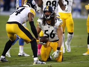Linebacker Anthony Chickillo and strong safety Terrell Edmunds of the Pittsburgh Steelers react during a game against the Los Angeles Chargers at Dignity Health Sports Park on October 13, 2019 in Carson, California.