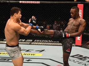 Israel Adesanya kicks Paulo Costa during their middleweight championship bout at UFC 253 inside Flash Forum on UFC Fight Island in Abu Dhabi on Sept. 27, 2020. Josh Hedges/Zuffa LLC via Getty Images