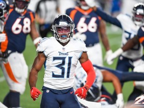 Kevin Byard of the Tennessee Titans celebrates after forcing a second quarter fumble against the Denver Broncos at Empower Field at Mile High on September 14, 2020 in Denver, Colorado.