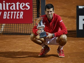 Novak Djokovic of Serbia poses with the trophy after winning his men's final match against Diego Schwartzman of Argentina during day eight of the Internazionali BNL d'Italia at Foro Italico on Sept. 21, 2020 in Rome, Italy.