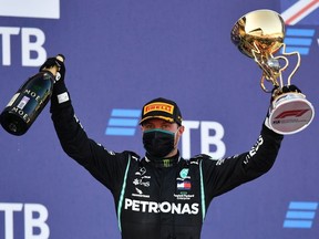 Race winner Valtteri Bottas of Finland and Mercedes GP celebrates on the podium during the F1 Grand Prix of Russia at Sochi Autodrom on September 27, 2020 in Sochi, Russia.