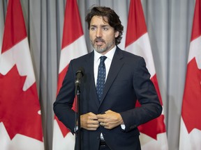 Prime Minister Justin Trudeau speaks with the media before the first day of a Liberal cabinet retreat in Ottawa, Monday Sept. 14, 2020.