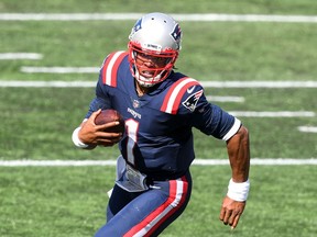 QB Cam Newton, running in for a TD against Miami in his Patriots debut, showed he’d be the team’s top QB from his early days in camp.