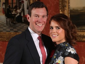 Princess Eugenie and Jack Brooksbank pose in the Picture Gallery at Buckingham Palace after they announced their engagement on January 22, 2018 in London.