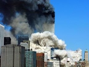 In this file photo taken on September 11, 2001, smoke billows after the first of the two towers of the World Trade Center collapses in New York City.