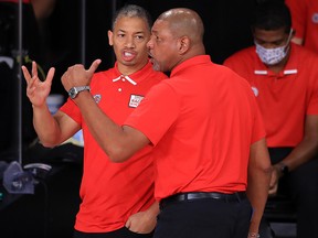 Clippers assistant coach Tyronn Lue talks with head coach Doc Rivers during the NBA Playoffs at AdventHealth Arena at the ESPN Wide World Of Sports Complex on September 12, 2020 in Lake Buena Vista, Florida.