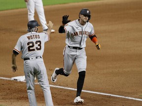 Hunter Pence of the San Francisco Giants rounds third after a three-run home run in the seventh inning against the Houston Astros at Minute Maid Park on Aug. 11, 2020 in Houston, Texas.