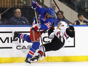 Marc Staal of the New York Rangers steps into Jean-Gabriel Pageau of the Ottawa at Madison Square Garden on November 19, 2017 in New York.