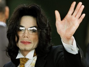 In this file photo taken June 3, 2005, Michael Jackson waves as he arrives at the Santa Barbara County courthouse in Santa Maria, Calif.