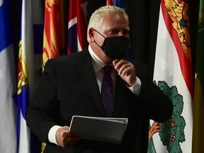 Premier Doug Ford leaves a press conference in Ottawa on Friday, Sept. 18, 2020.