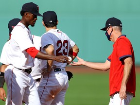 Boston Red Sox manager Ron Roenicke relieves Robinson Leyer during the sixth inning against the Toronto Blue Jays at Fenway Park on September 6, 2020 in Boston.