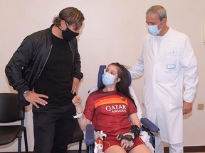 Former AS Roma captain Francesco Totti meets 19-year-old Ilenia Matilli, who recently woke up from a coma after a serious road accident in December, at the Gemelli hospital in Rome September 28, 2020.