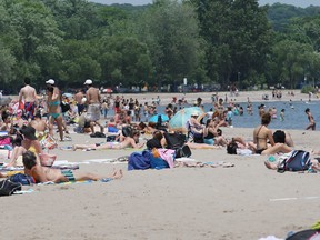 People along the beach at Ashbridges Bay. Wednesday June 20, 2012.