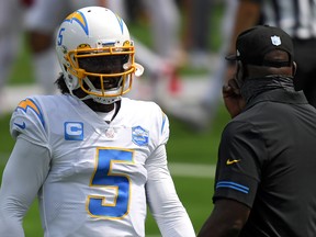 Quarterback Tyrod Taylor of the Los Angeles Chargers talks to head coach Anthony Lynn before a game  against the Kansas City Chiefs at SoFi Stadium on September 20, 2020 in Inglewood, California.