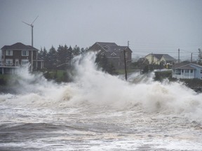 Waves batter the shore in Cow Bay, N.S., on Wednesday, Sept. 23, 2020.