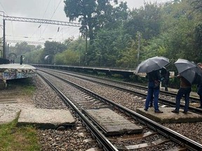 Investigators work at the scene following the death of an employee of the U.S. embassy in Ukraine, who was found unconscious by railway tracks in a park in Kyiv September 30, 2020