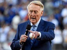 Former Los Angeles Dodgers broadcaster Vin Scully addresses fans at Dodger Stadium on October 25, 2017 in Los Angeles.