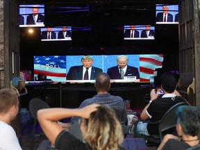 People watch a broadcast of the first debate between President Donald Trump and Democratic presidential nominee Joe Biden at The Abbey  on September 29, 2020 in West Hollywood, California.