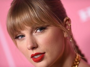 In this file photo taken on December 12, 2019 US singer-songwriter Taylor Swift arrives for Billboard's 2019 Woman of the Year at the Holllywood Palladium in Los Angeles.