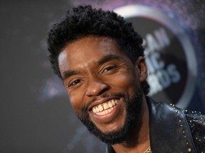 In this November 24, 2019, file photo US actor Chadwick Boseman poses in the press room during the 2019 American Music Awards at the Microsoft theatre in Los Angeles.
