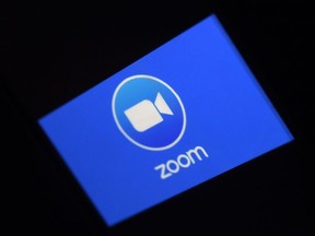 In this file photo illustration a Zoom App logo is displayed on a smartphone on March 30, 2020 in Arlington, Virginia.