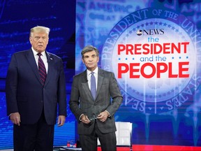 U.S. President Donald Trump poses with ABC New anchor George Stephanopoulos ahead of a town hall event at the National Constitution Center in Philadelphia, Pa. on Sept. 15, 2020.
