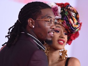 In this file photo taken on October 9, 2018 US rapper Cardi B and US rapper Offset arrive at the 2018 American Music Awards in Los Angeles, California.