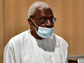 Former global athletics chief Lamine Diack arrives on September 16, 2020 at Paris' courthouse to hear the verdict in his corruption trial along with four other defendants over Russian doping cases.