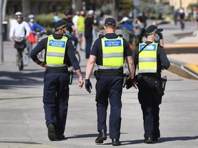 Protective services officers patrol along the St Kilda Beach foreshore in Melbourne on September 3, 2020 as the city battles an outbreak of the COVID-19 coronavirus.