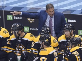 Boston Bruins head coach Bruce Cassidy gestures during Game 4 of the second round of the Stanley Cup playoffs against the Tampa Bay Lightning at Scotiabank Arena.