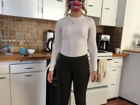 Caitlin Bernier has filed a human rights complaint claiming she was fired from her sales job at an Edmonton car dealership after being accused of making her male colleagues uncomfortable by wearing see-through shirt to work, the same wool long-sleeve white top she's seen wearing here.