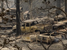 Burned vehicles sit completely destroyed after the Creek Fire swept through the area on September 8, 2020 near Shaver Lake, California.