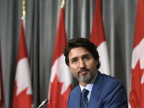 Prime Minister Justin Trudeau listens to a question during a news conference on the COVID-19 pandemic on Parliament Hill in Ottawa, on Friday, Sept. 25, 2020.