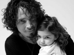 Chris Cornell's wife shares an old photo on his Instagram page of the rocker with his daughter in a post that included a song he wrote to his child.