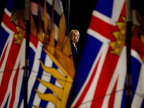 Provincial Health Officer Dr. Bonnie Henry looks on during a press conference in the rotunda at Legislature in Victoria, Wednesday, May 6, 2020.