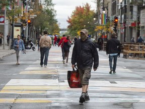 People walk in downtown Motreal, Tuesday, September 29, 2020.